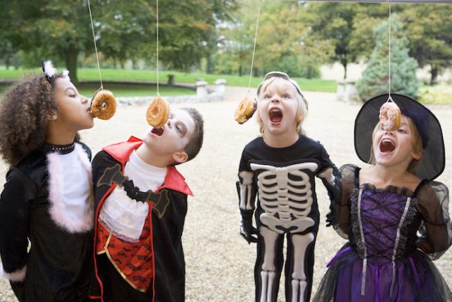 Halloween party game for kids: donut eating race